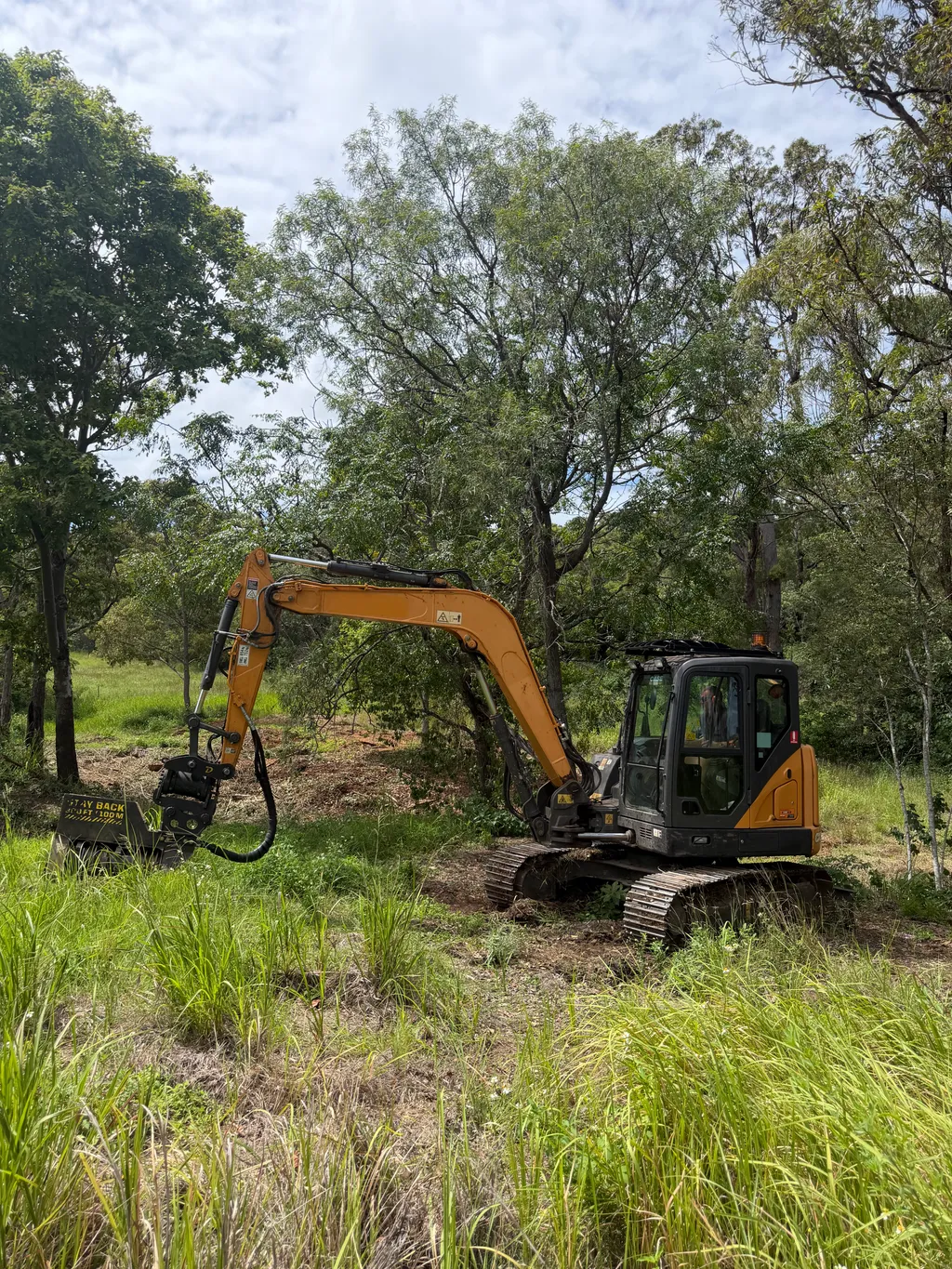 8-tonne excavator with mulcher attachment on site