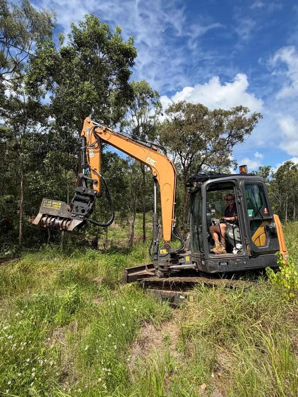 8-tonne excavator with mulcher attachment in action